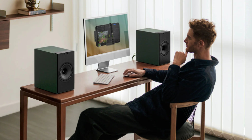 KEF Coda W active bookshelf speakers with sleek black finish and modern design, showcasing their compact and stylish appearance.