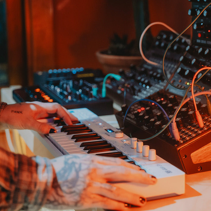 Arturia KeyStep 37 MK2 sequencer keyboard with 37 keys, colorful control knobs, and built-in sequencing features.