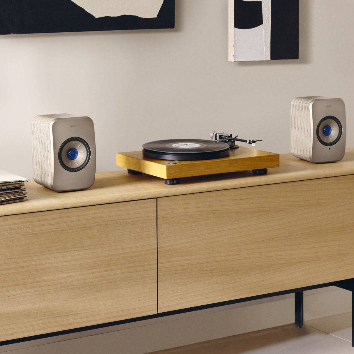 KEF LSX II active bookshelf speakers with sleek black finish and soundwave artwork on the side, compact and modern design.