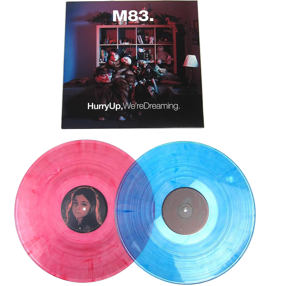M83 15th Anniversary Clear Pink and Blue vinyl 2LP of Hurry Up, We're Dreaming, featuring rock, indie, and pop album artwork.