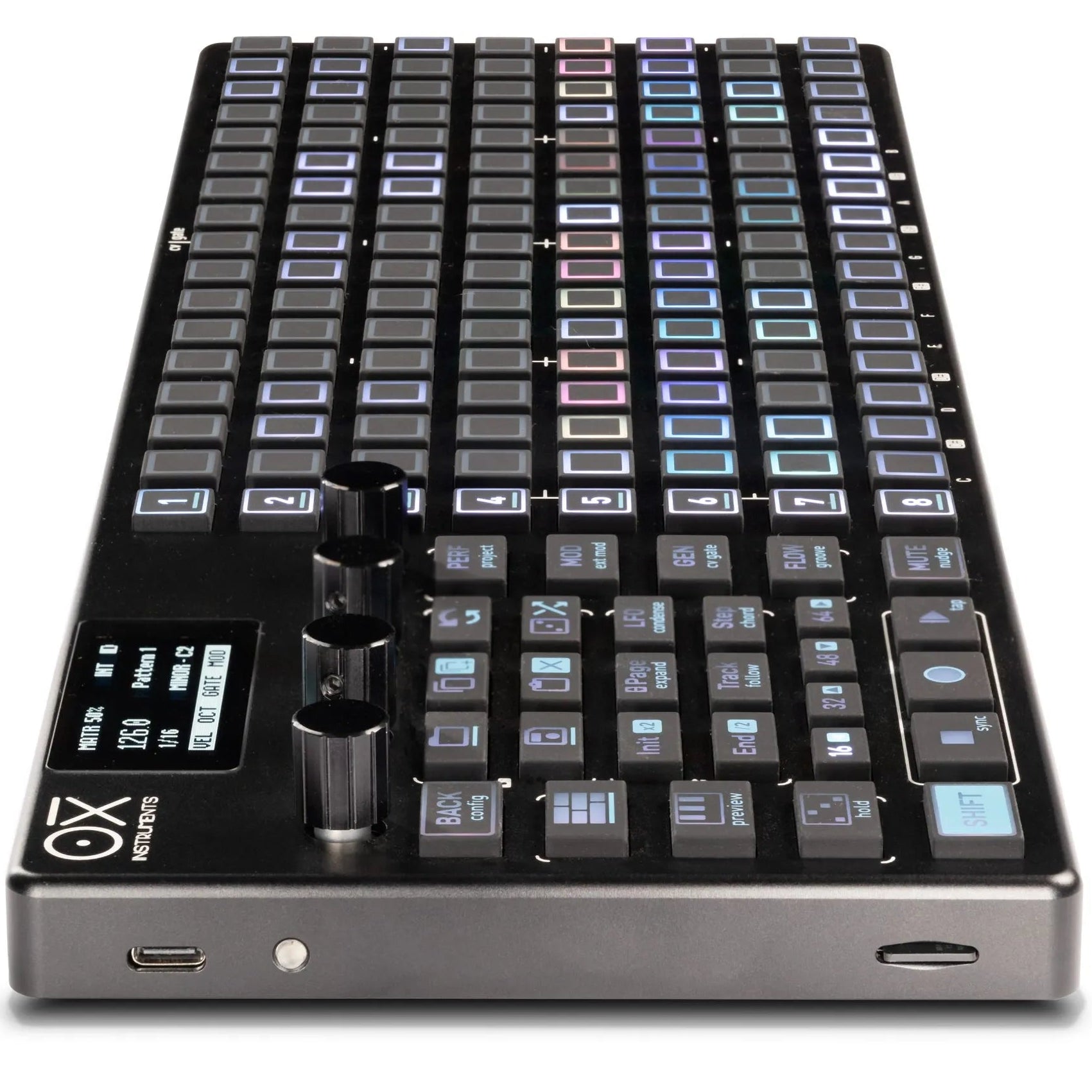 OXI Instruments One MKII sequencer with black side panel, showing control buttons and display screen on a sleek electronic device.