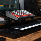 Melbourne Instruments Nina semi-modular synthesizer with multiple patch points and colorful interface controls.