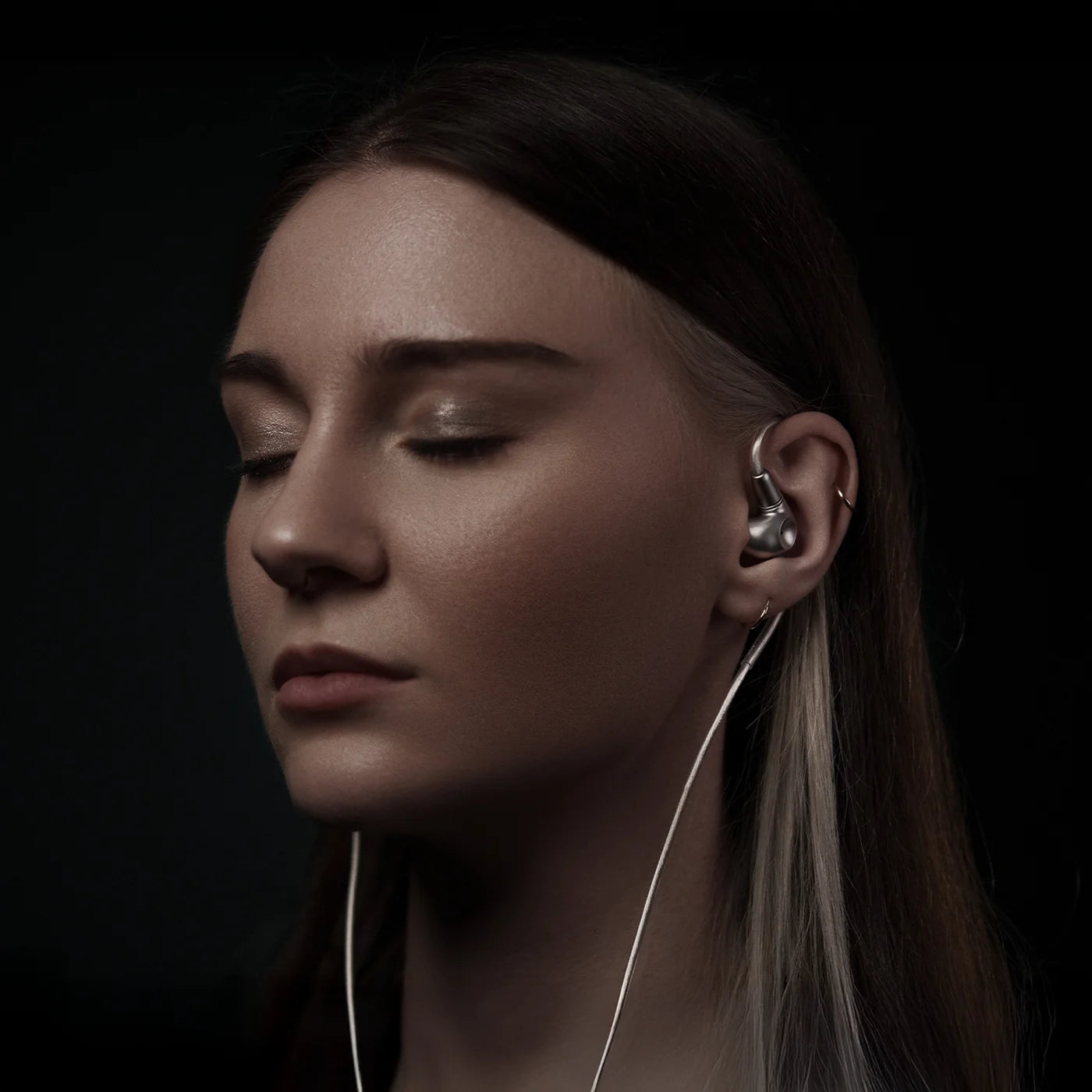 Meze Audio Astru wired in-ear monitor headphones with sleek black design and in-ear silicone tips.