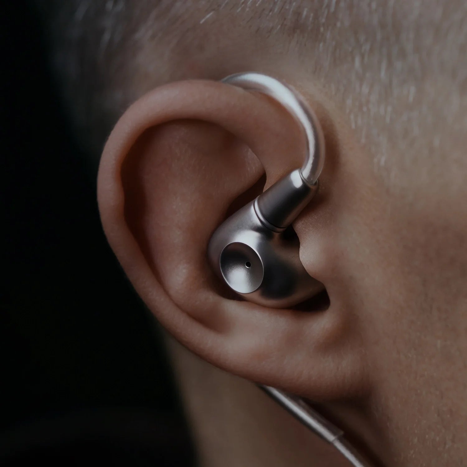 Meze Audio Astru wired in-ear headphones with comfortable ear tips and sleek design, shown in a close-up image.