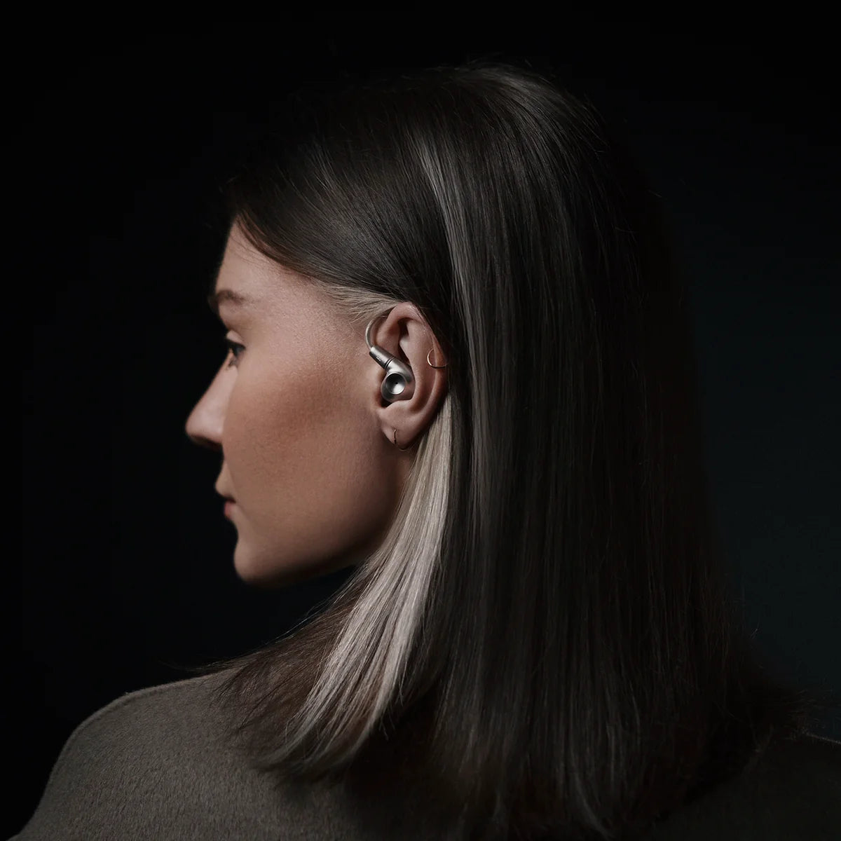 Meze Audio Astru wired in-ear headphones with sleek black earbuds and braided cable, designed for high-quality audio.