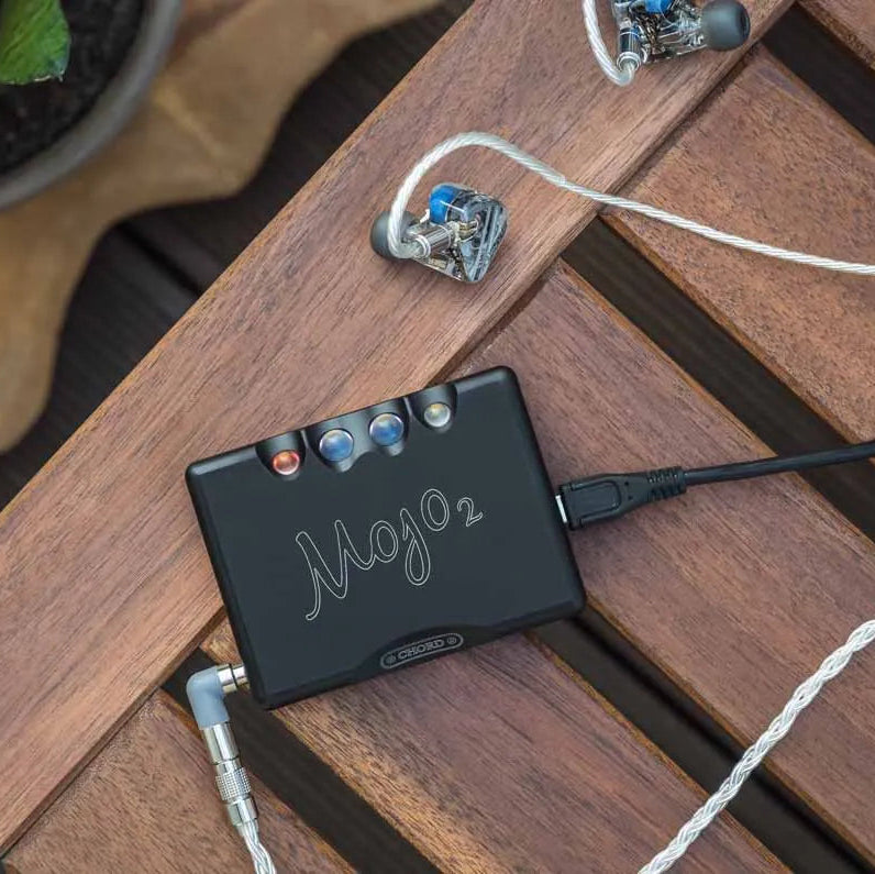 Chord Electronics Mojo 2 headphone amplifier and DAC with sleek black finish, compact design, and various input ports.