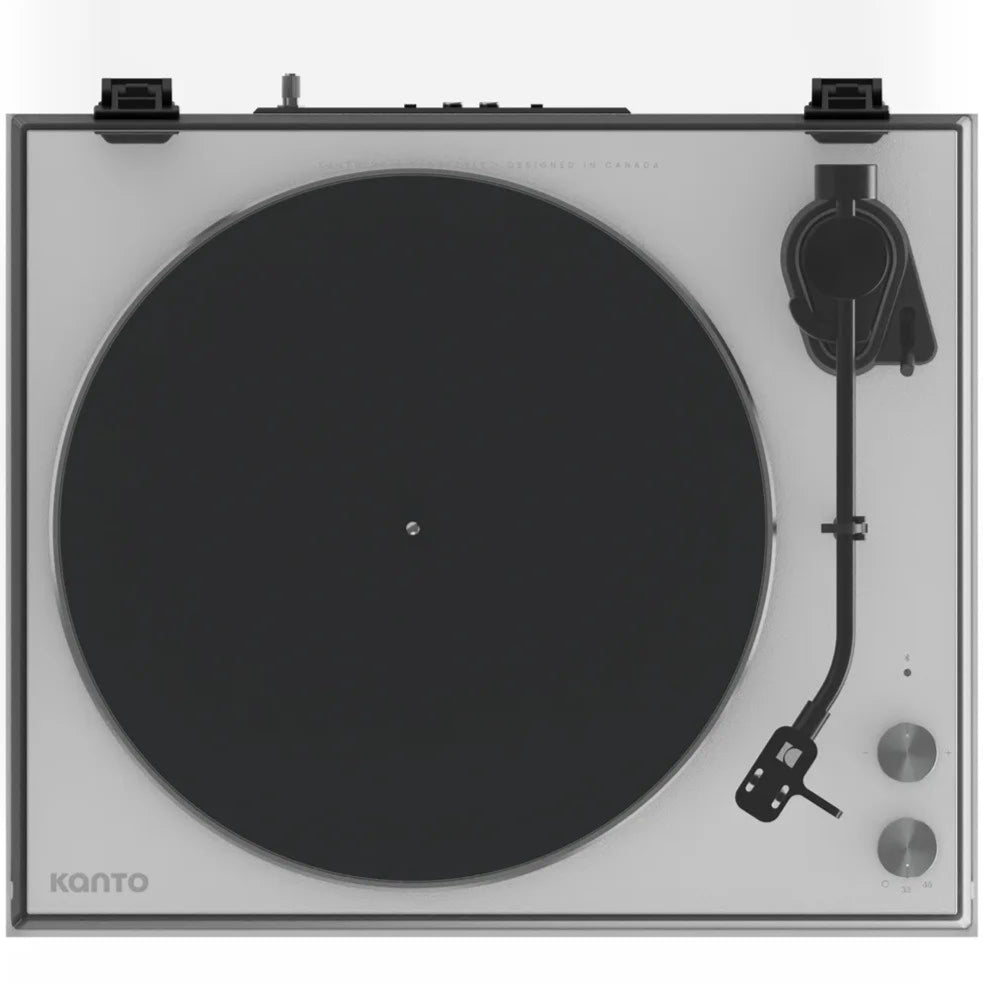 Top-down view of the Kanto Audio OBI3 turntable with a sleek cover in white, showcasing its modern design and controls.