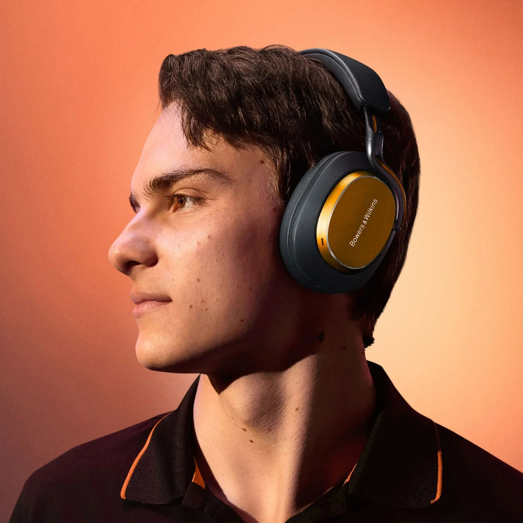 Bowers & Wilkins PX8 S2 McLaren Edition wireless headphones with sleek design and branded accents, shown on a white background.