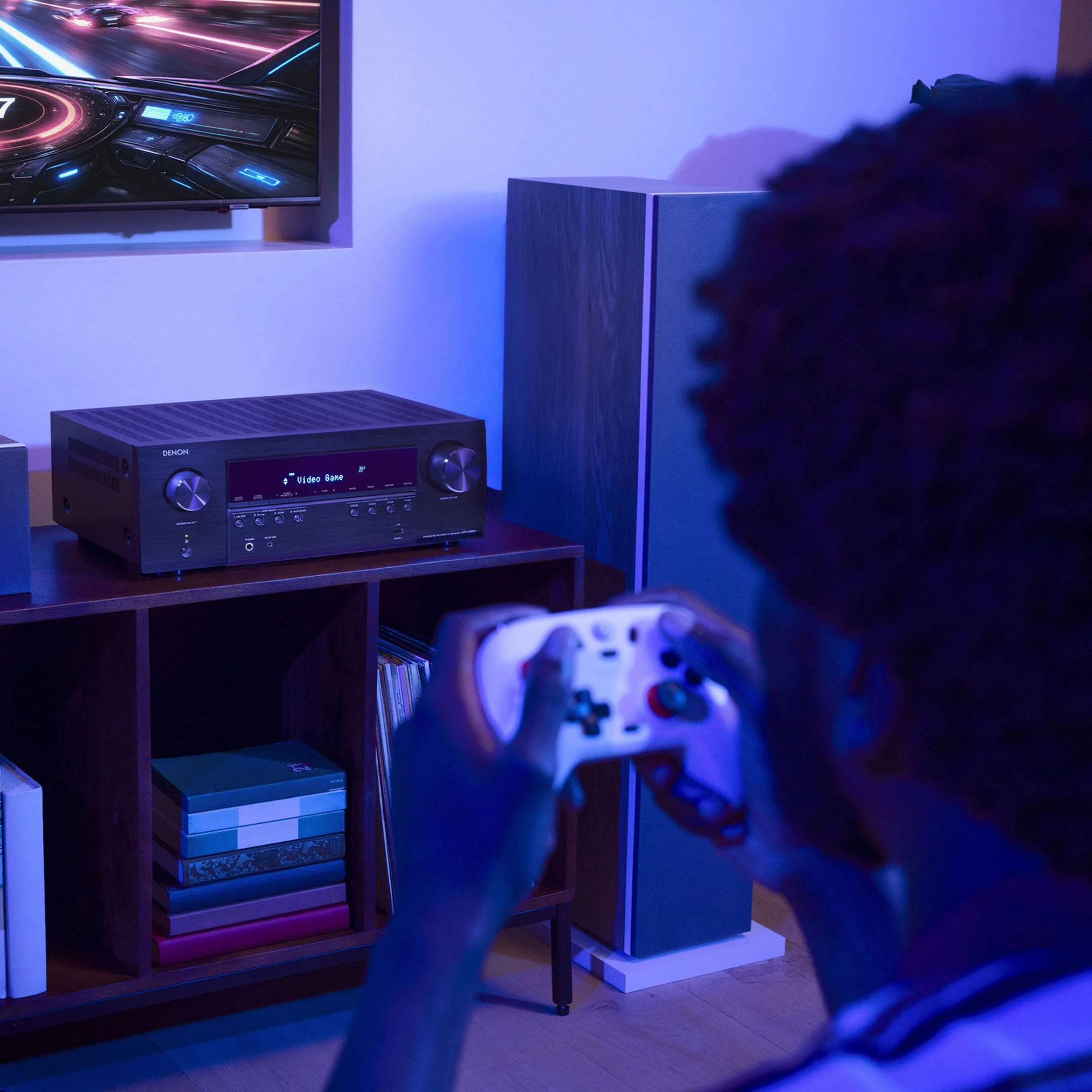 Denon AVR-S980H stereo amplifier with modern design and multiple input options, shown in a sleek black finish.