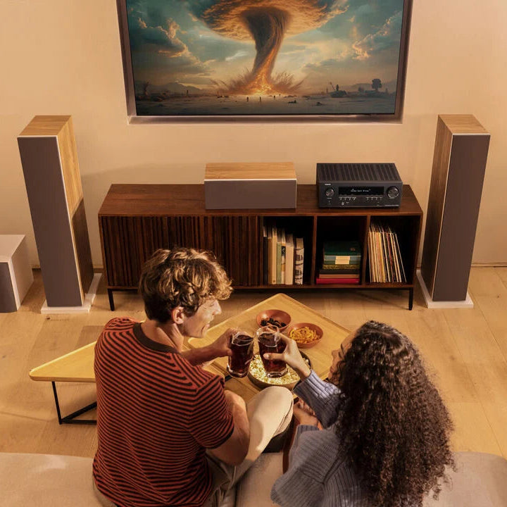 Denon AVR-S980H stereo amplifier with front panel controls and display, black finish, and multiple input ports visible.