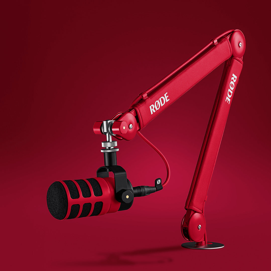 Red Rode PSA1+ broadcast microphone arm with adjustable arm and sturdy mounting bracket for professional studio use.