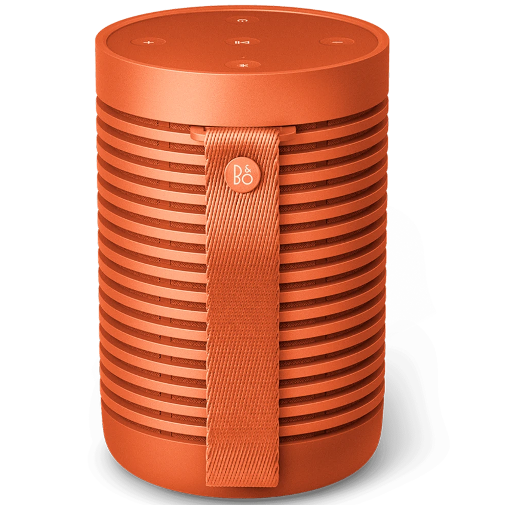 Bang & Olufsen Beosound Explore portable speaker in Bonfire Orange, showing the compact, rugged design with textured surface.