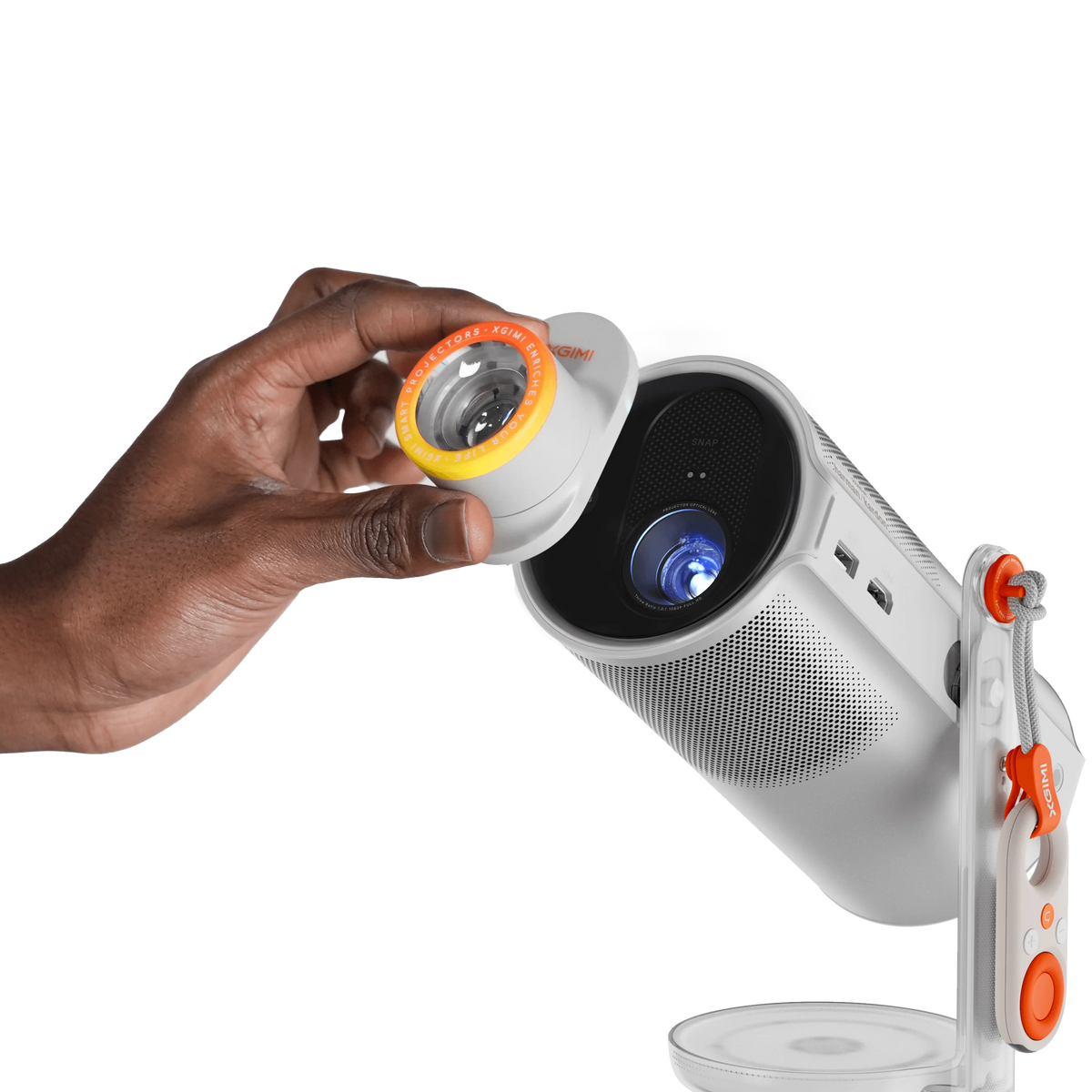 Xgimi Mogo 4 portable projector displaying colorful image on wall, compact design with built-in lens and ventilation.