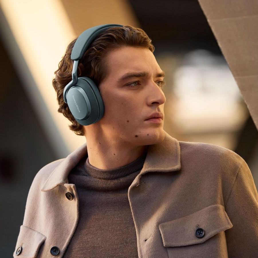 Bowers & Wilkins Px7 S3 wireless headphones in Frost Blue with plush ear cushions and sleek over-ear design.