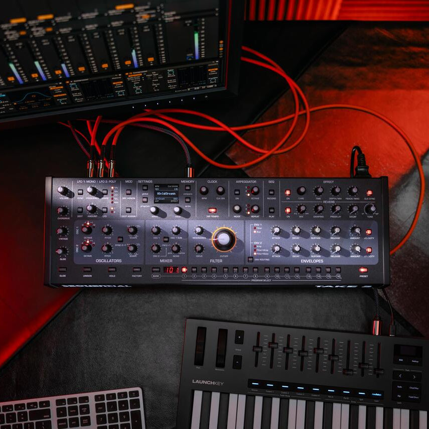 Sequential Take 5 desktop synthesizer with control knobs and display, featuring a sleek design and multiple connectivity options.