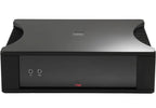 Rega Solis stereo amplifier showcasing sleek design and control knobs in a modern setup.