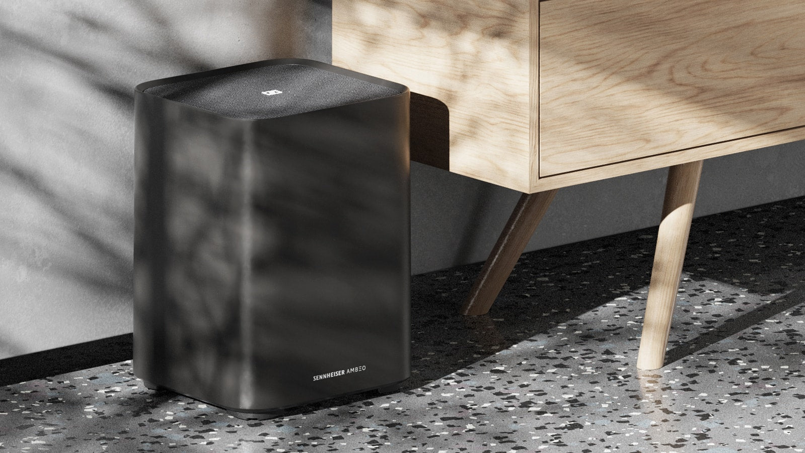 Sennheiser Ambeo Subwoofer for immersive home theater, showcasing the sleek black subwoofer with control panel and bass ports.