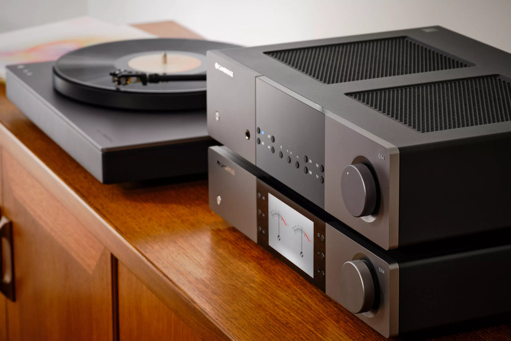Cambridge Audio EXA100 stereo amplifier with a turntable connected for high-quality audio playback.