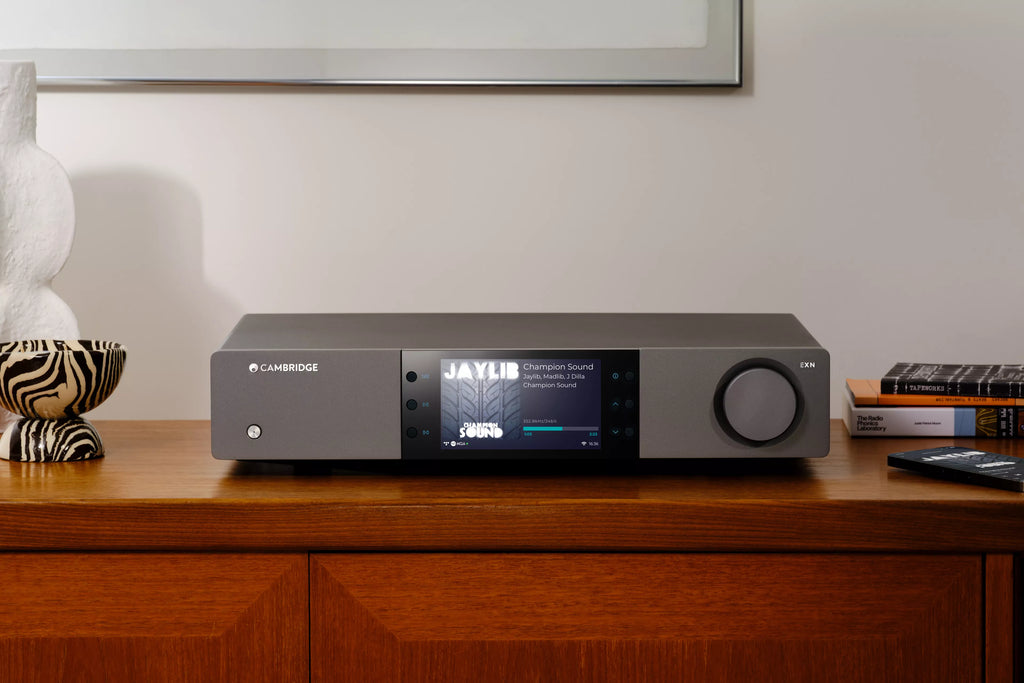 Cambridge Audio EXN100 music streamer front view showing sleek design and control interface.
