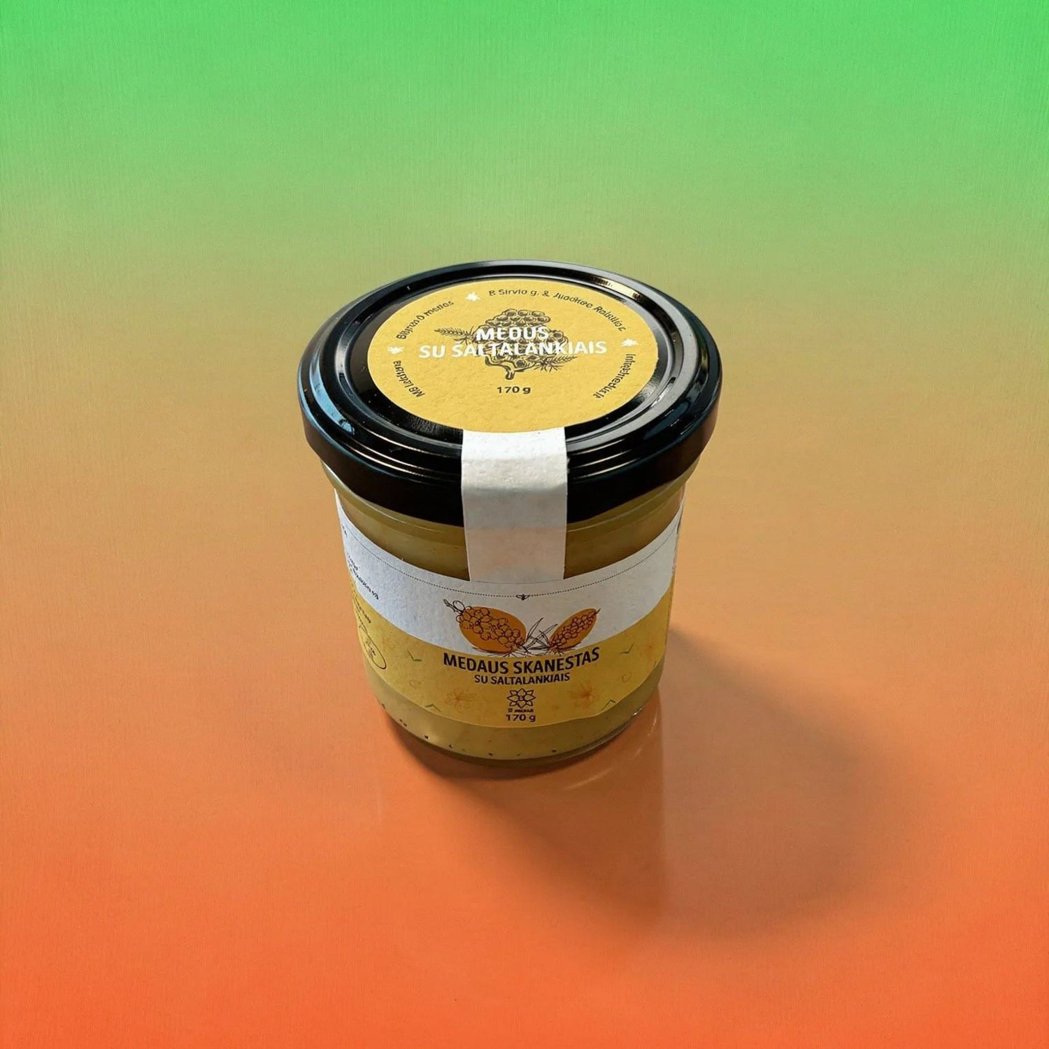 9 medūs Honey Snack with Sea Buckthorn in a 170g jar, featuring golden honey and vibrant sea buckthorn berries.