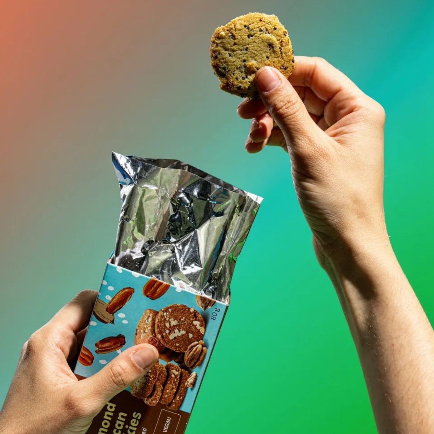 The Beginnings Almond & Pecan Cookies packaging with cookies visible, showcasing a box of almond and pecan cookies from The Beginnings brand.