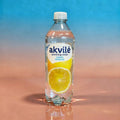 Akvilė Lemon lightly sparkling water in a 600ml bottle, clear with a lemon flavor and bubbles, on a plain background.