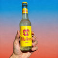Illustration of Fritz-Limo Lemon unfiltered sour lemonade in a 330ml bottle, showcasing a fresh lemon and vibrant citrus design.