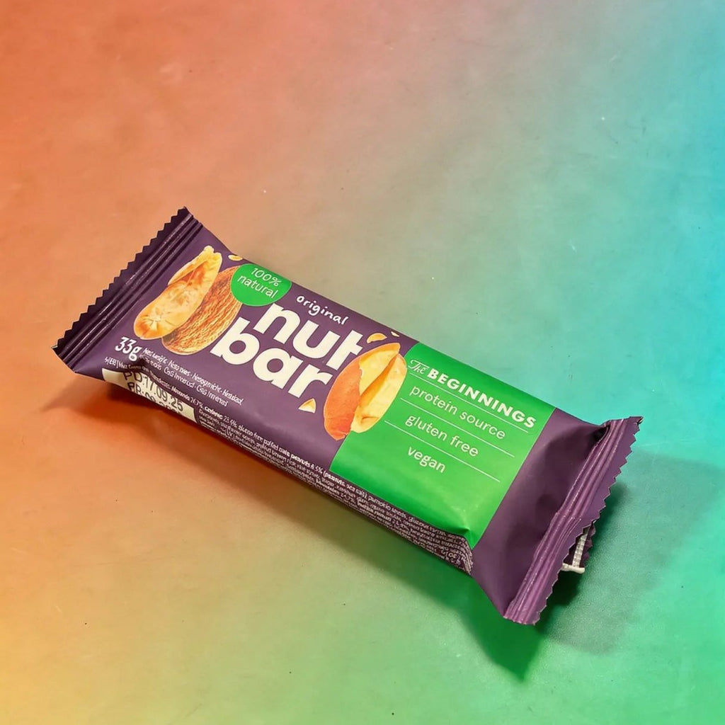 Illustration of The Beginnings Original Nut & Seed Bar with nuts and seeds visible in a natural, wholesome snack presentation.