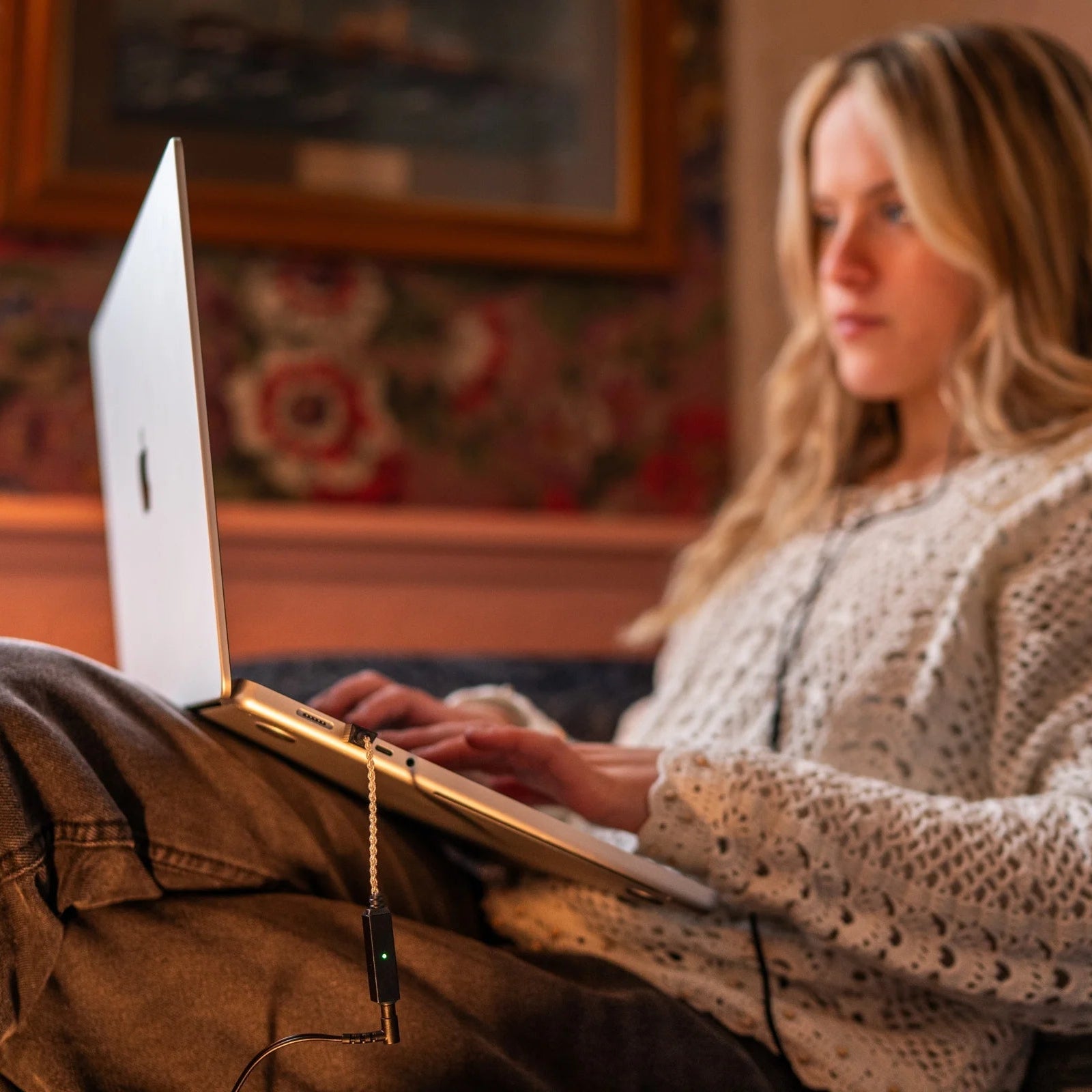 iFi Audio GO Link 2 headphone amplifier and DAC, compact silver device with control buttons and input ports on a white background.