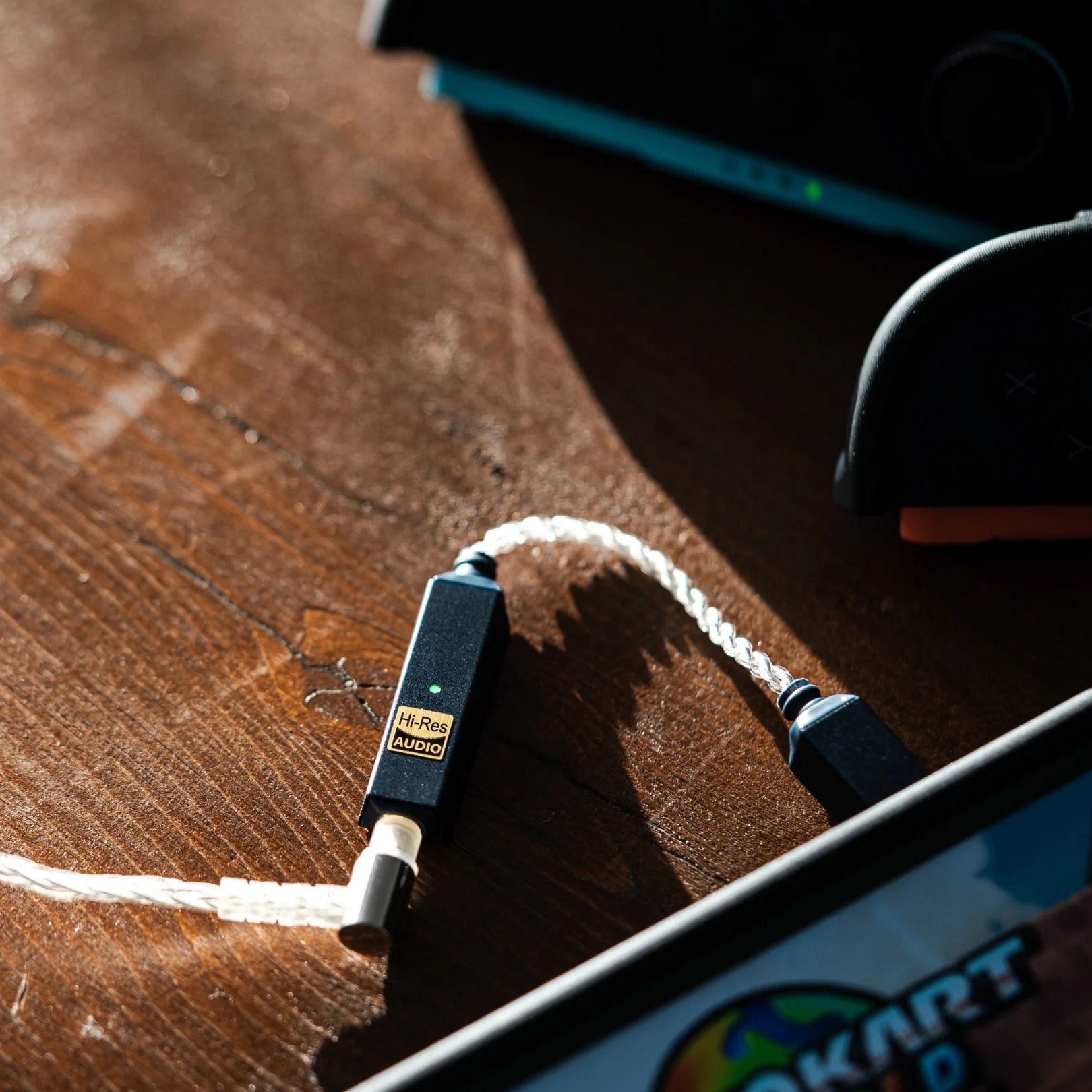 iFi Audio GO Link 2 headphone amplifier and DAC, compact device with sleek black design, USB and 3.5mm audio connectivity