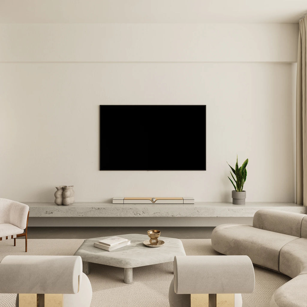 Devialet Dione soundbar with sleek design, shown in a modern living room setup for immersive TV audio experience.