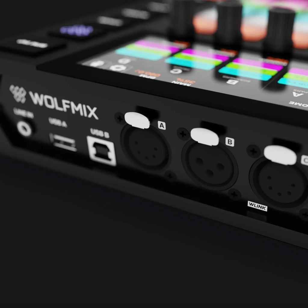 Wolfmix W1 MK2 lighting controller interface with multiple input ports and control buttons for professional stage lighting setups.