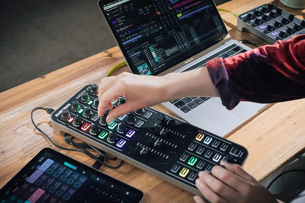Allen & Heath Xone:K3 DJ controller with multiple knobs, faders, and buttons for professional DJ mixing and performance.