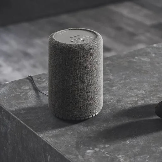 Wireless Audio Pro A10 MK2 speaker, compact and sleek, showcasing its modern design and control buttons.