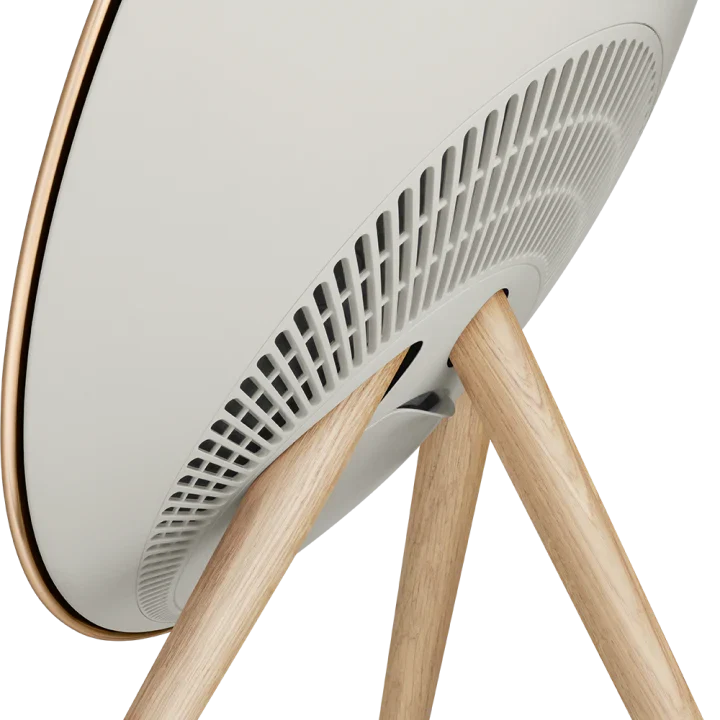 Gold Bang & Olufsen Beosound A9 5th Gen wireless speaker with sleek, modern design and fabric-covered exterior.