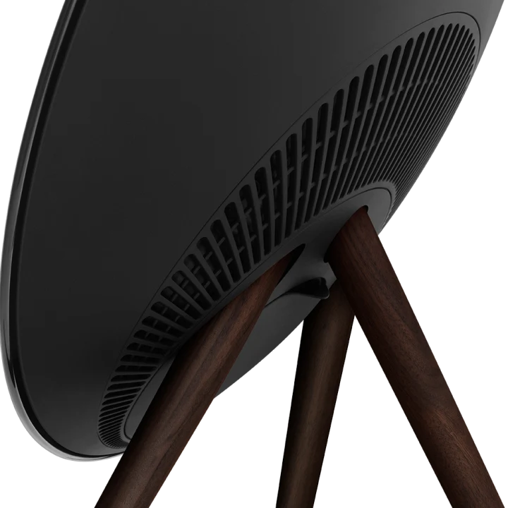 Gold Bang & Olufsen Beosound A9 5th Gen wireless speaker with a sleek, circular design and fabric-covered exterior.