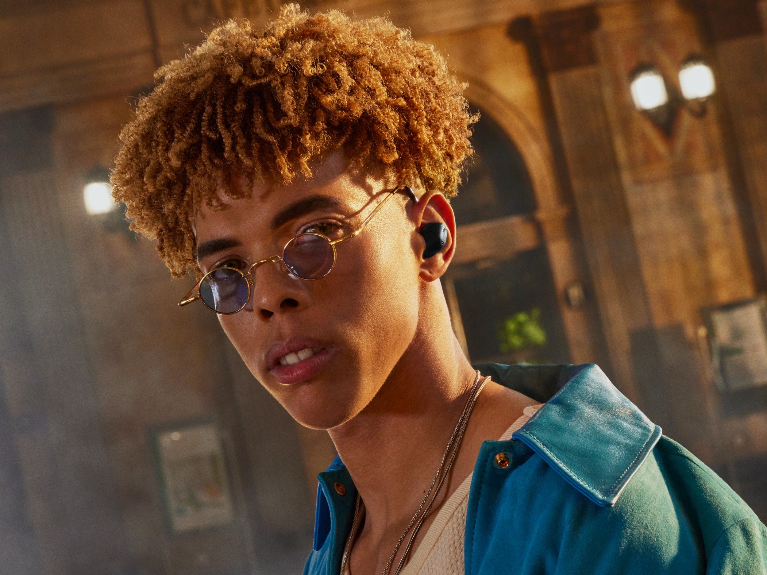 Sennheiser Accentum True Wireless in-ear headphones in black worn by a man, showcasing their sleek design and portable style.