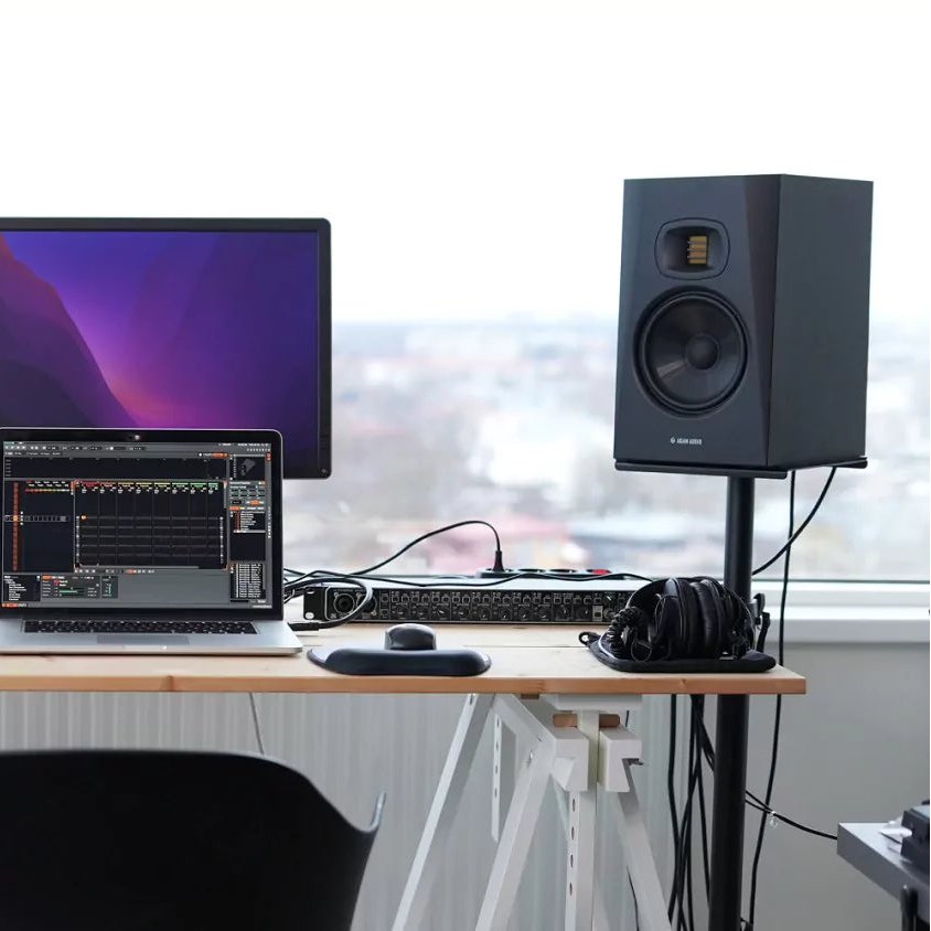 Adam Audio T7V active nearfield studio monitors shown in a professional home studio setup