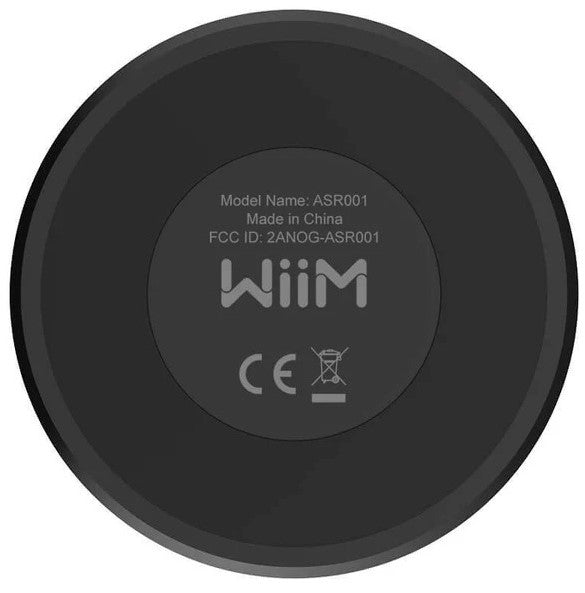 WiiM Mini music streamer device with AirPlay 2 support, compact design, and connection ports for high-quality audio streaming.