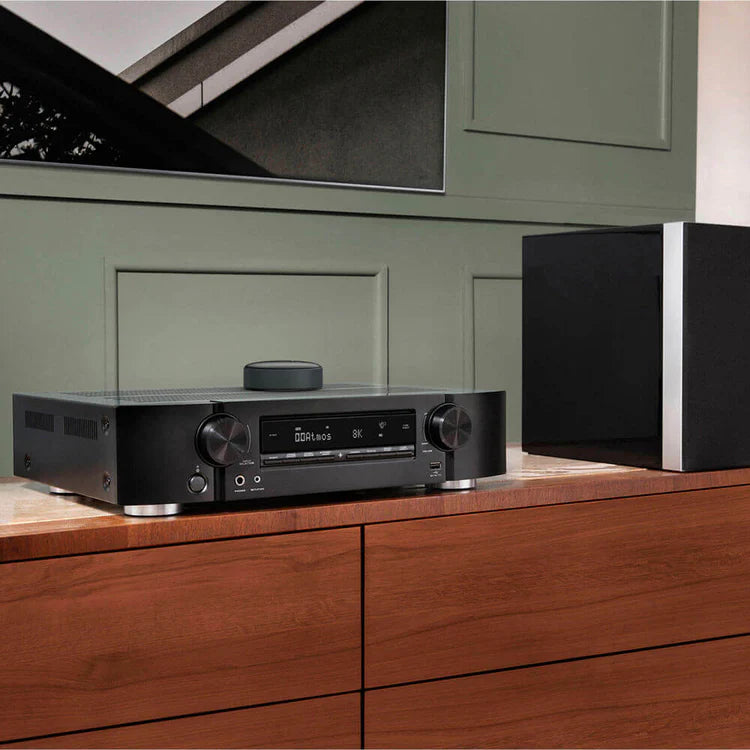 WiiM Mini music streamer device with AirPlay audio streaming capabilities, compact design, and modern black finish.