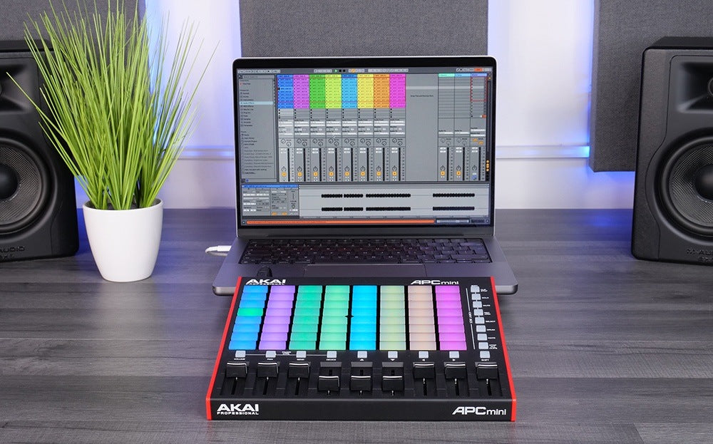 Akai Professional APC Mini MK2 MIDI controller with compact grid of colorful performance pads and control knobs.