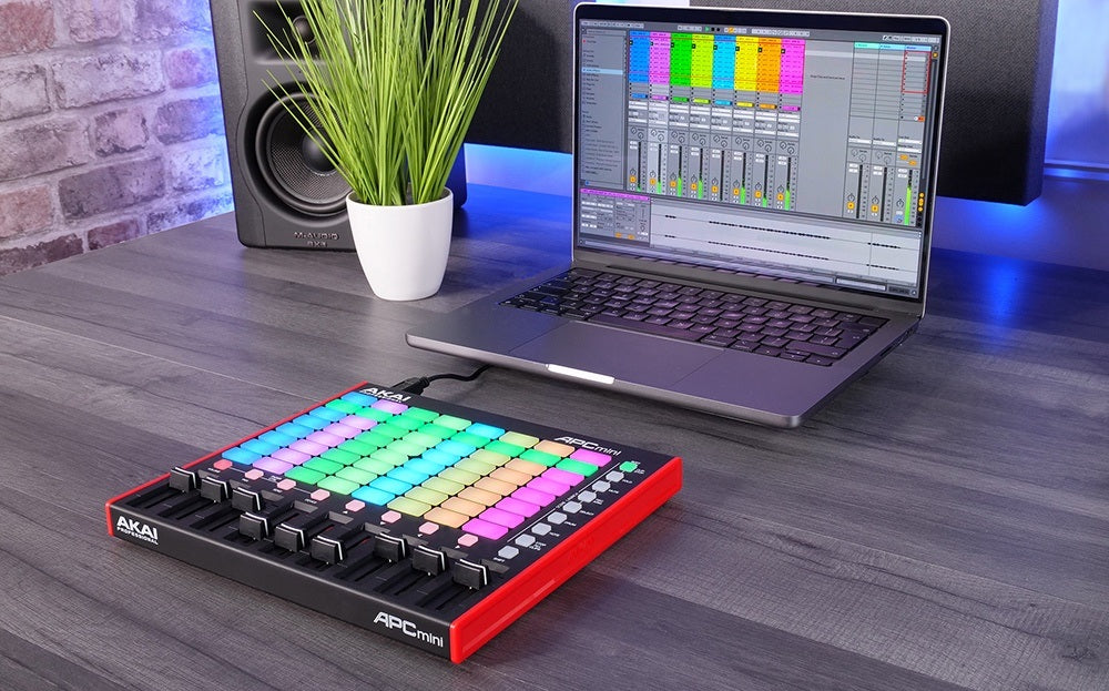 Akai Professional APC Mini MK2 MIDI controller with bright backlit pads and compact design for music production and performance.