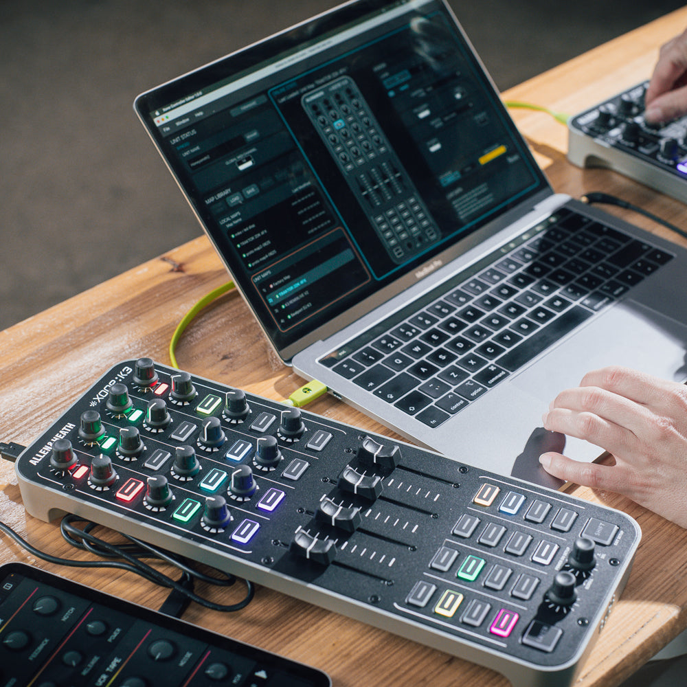 Allen & Heath Xone:K3 DJ controller with jog wheels, faders, and control knobs for professional DJ mixing and performance.