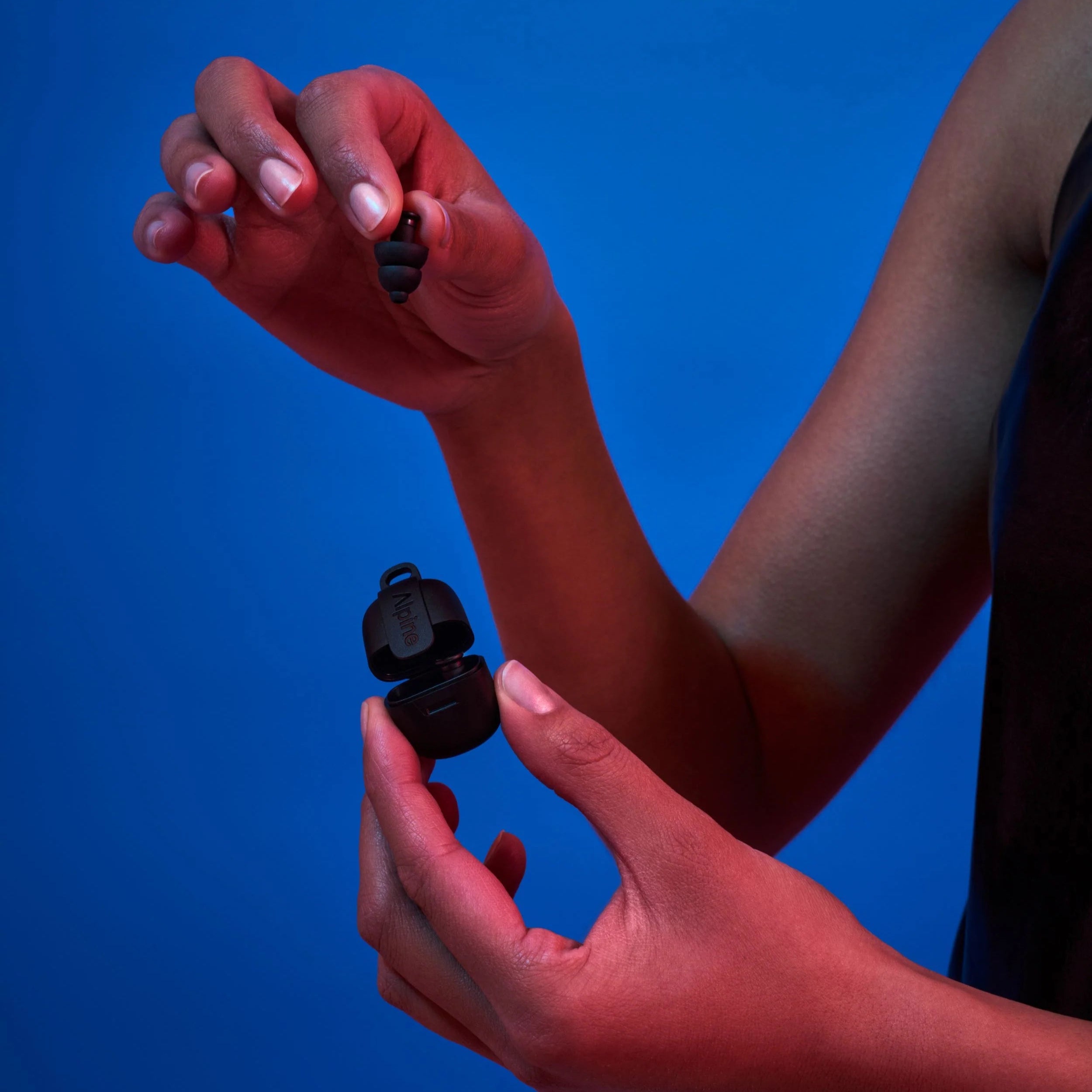 Alpine PartyPlug black earplugs in a compact case for hearing protection at events and loud environments.