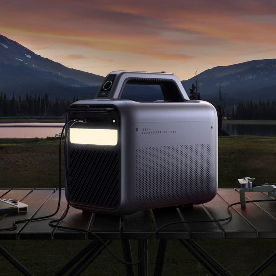 Nebula Mars 3 projector by Nebula with sleek design, showcasing its front view and lens in a modern home entertainment setup.