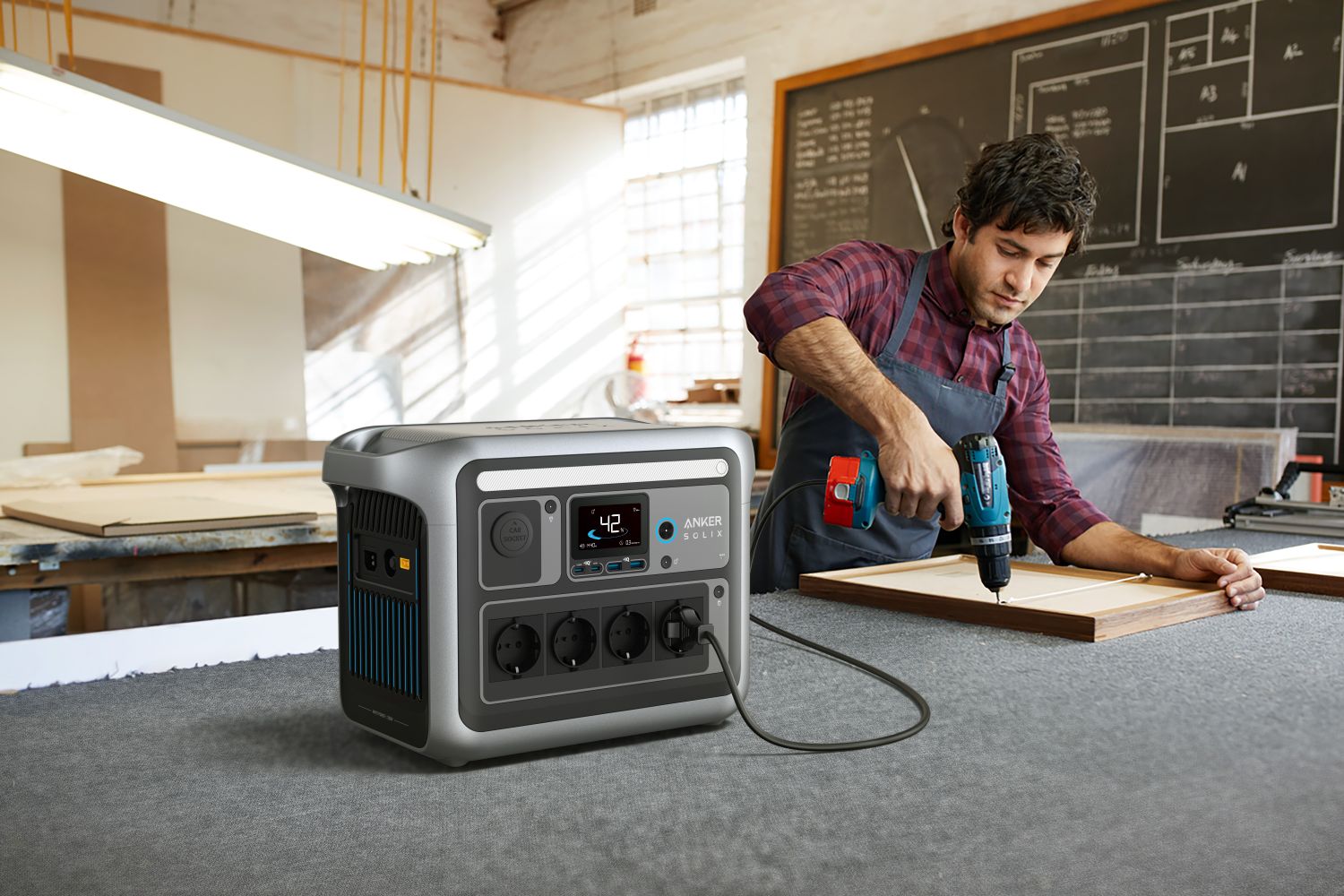 Anker Solix C1000X portable power station with 1056Wh capacity and 1800W output, shown with multiple charging ports and digital display.