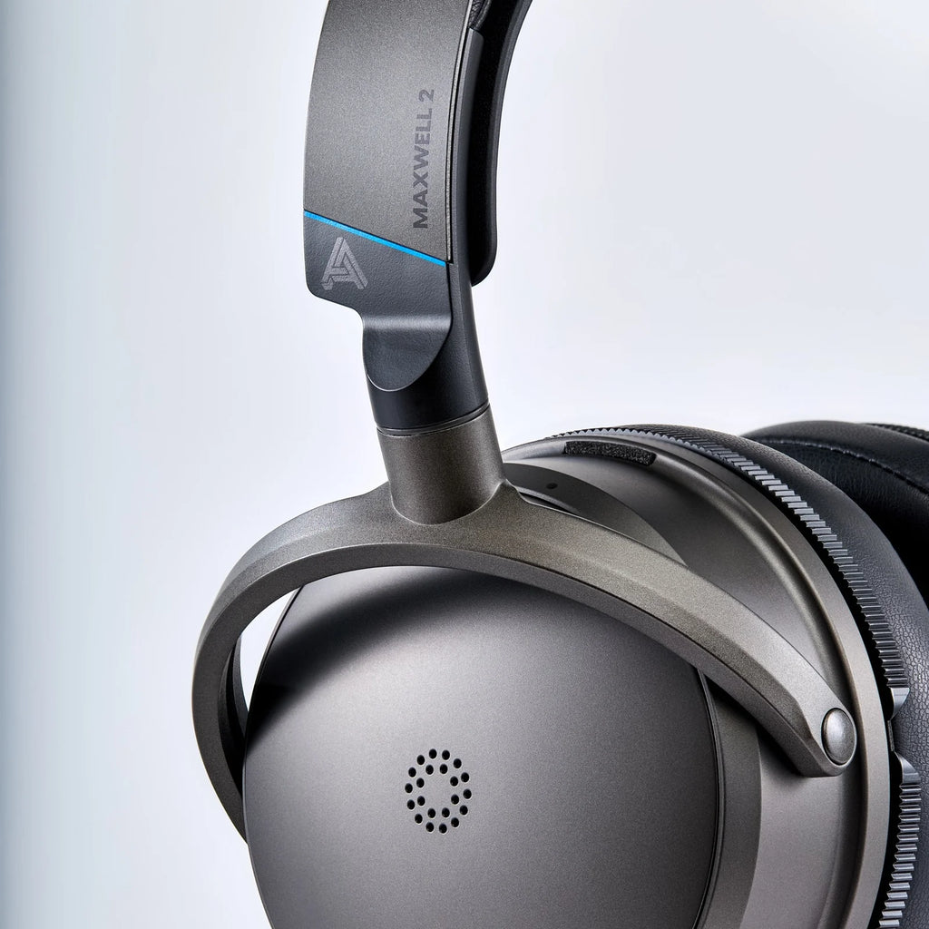 Audeze Maxwell 2 wireless gaming headphones for PlayStation, with over-ear design and built-in microphone, black color.