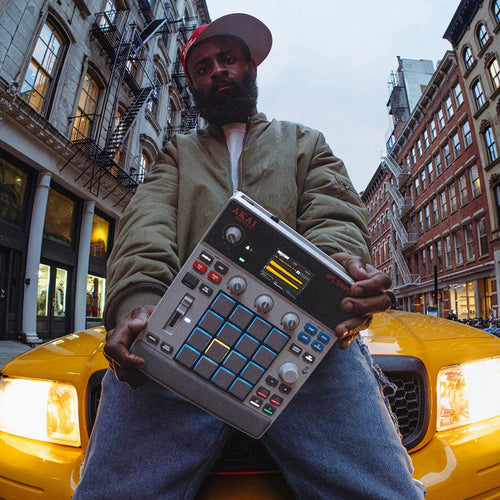 Akai Professional MPC sample drum machine and sampler with various pads and controls, showcasing its interface and design.