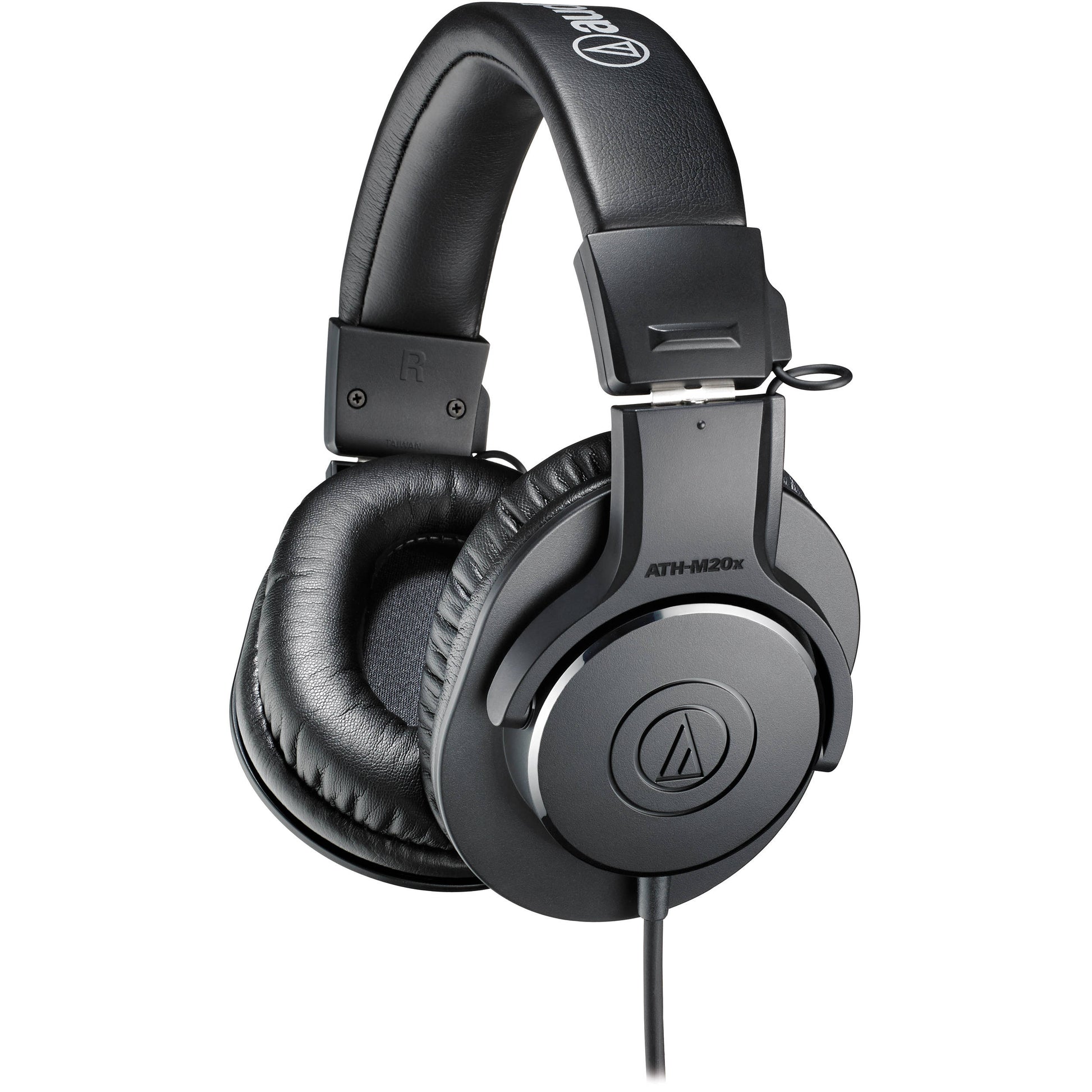 Audio-Technica ATH-M20x studio headphones in a home studio bundle, featuring over-ear design and adjustable headband.