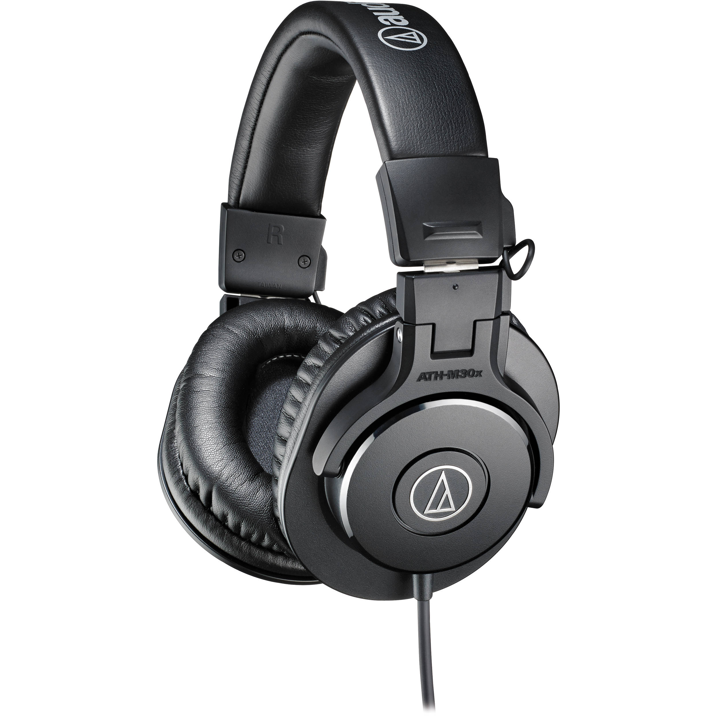 Audio-Technica ATH-M30x studio headphones in a home studio set, featuring professional-grade over-ear design and adjustable headband.